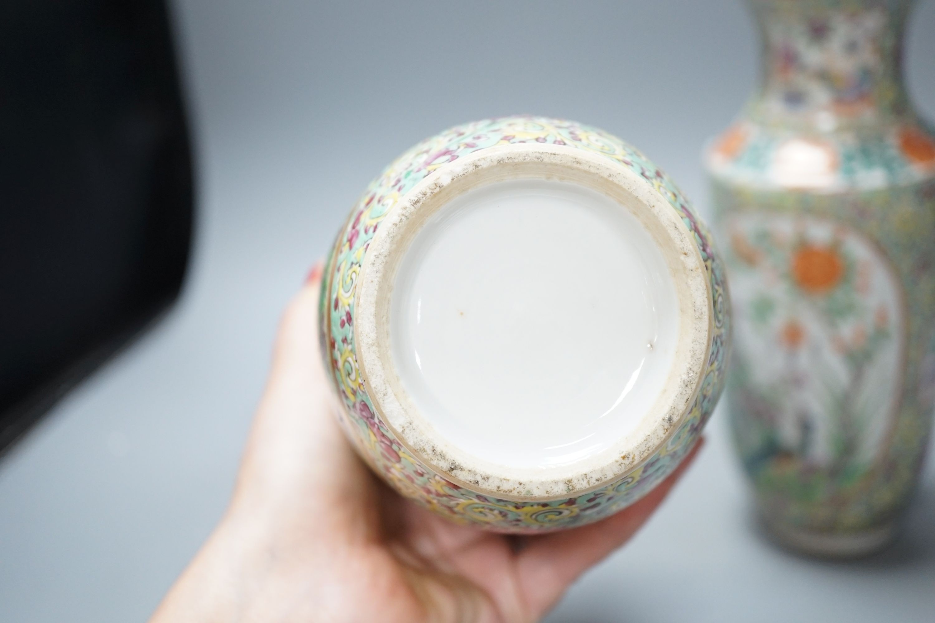 A pair of 19th century Chinese Canton decorated famille rose vases - 25cm tall
